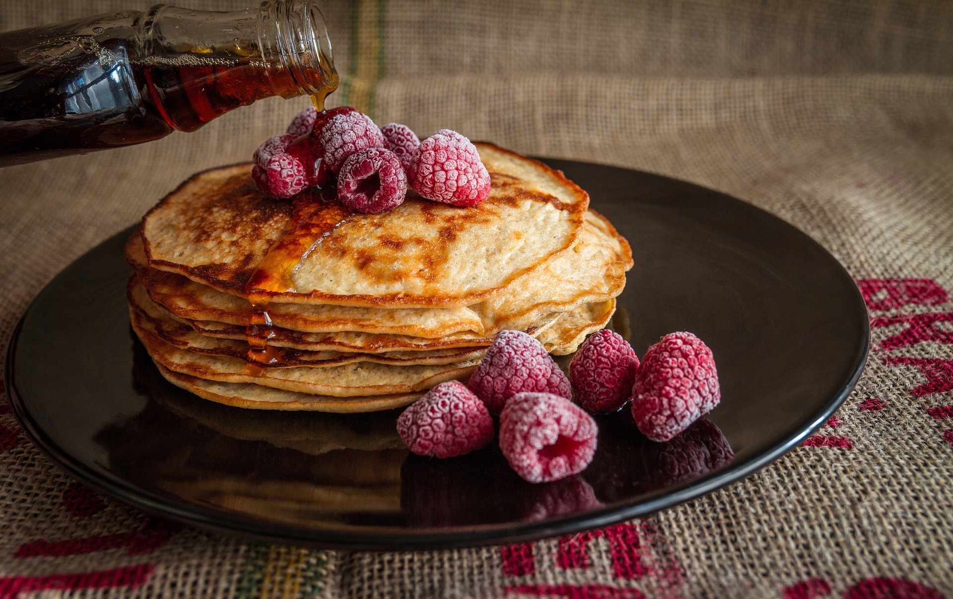 Pancakes topped with raspberries