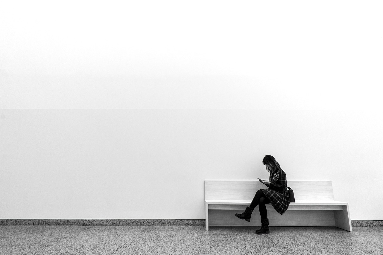 A woman on a bench in a museum